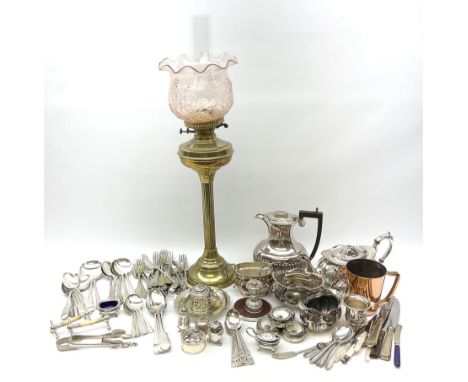 Brass oil lamp supporting a pink moulded glass shade and clear glass chimney, together with a group of metal ware including s
