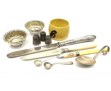 Cabinet items including two hallmarked silver thimbles, silver butter knife the handle and blade both hallmarked and other si