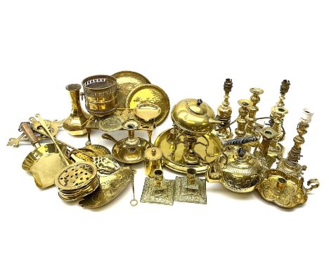 A group of assorted brassware, to include pair of lamp bases, further lamp, number of candlesticks and chamber sticks includi