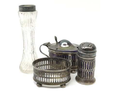 A three pieces 1920s silver cruet set, comprising mustard pot with shell thumb piece, open salt and pepperette, each with pie