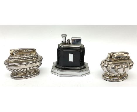 A Ronson Touch Tip chrome and bakelite table lighter, together with two silver plated Ronson table lighters. 