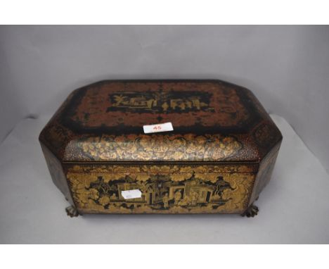 An antique Japan lacquer trinket or sewing case highly decorated with fantasy scenes