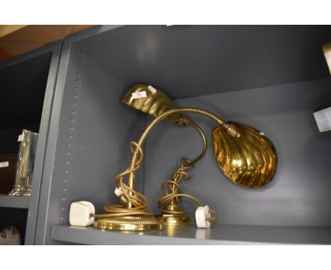 A goose neck brass lamp and similar fixed position having sea shell design shades
No damage or repairs, some age related wear