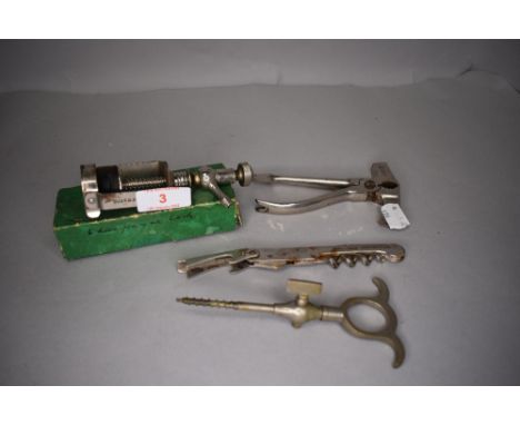 A selection of bar or waiters tools including champagne cork and screw