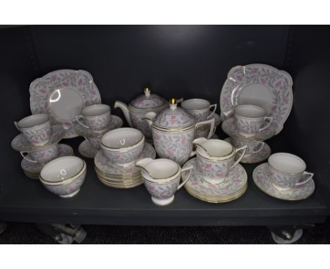 A part tea service by Mintons in the Petunia design service in good condition