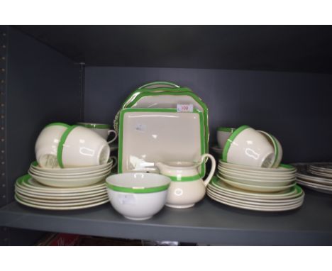 A part tea service in an art deco green colourway