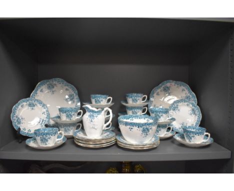 A late Victorian part tea service in a blue floral print