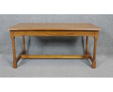 A mid century light oak coffee table in the antique style. H.46 W.94 D.48cm 