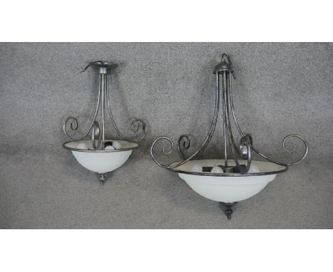 A metal framed ceiling light with domed frosted shade and a similar smaller example. H.70 W.70cm (Largest). 