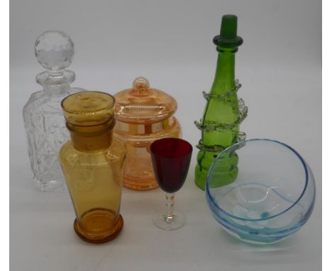 A collection of coloured glass. Including an Art Deco amber glass decanter and stopper, a Caithness floral design spherical b