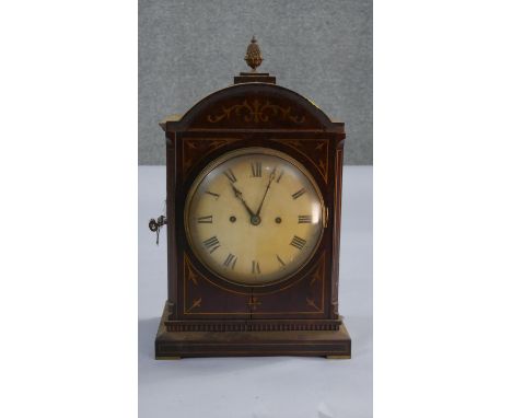 A Victorian mahogany inlaid mantle clock. Brass plaque reads John Walton, 1900. Key does not work. Back locked. H.16 W.10cm 