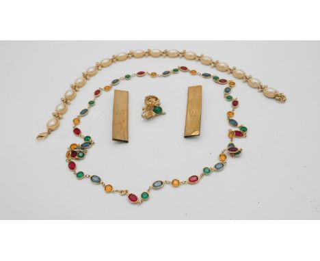 A collection of costume jewellery. Including a Christian Dior faux pearl statement articulated necklace, a Craft lion brooch 