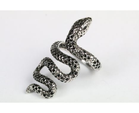 Silver and black stone snake ring in the form of a coiled snake set with round cut faceted black stones. Marked 925. Size P.5