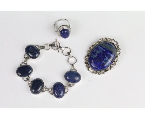 Lapis lazuli jewellery suite to include brooch, panel bracelet and ring. Ring size Q.5. Brooch measures 5cm. 