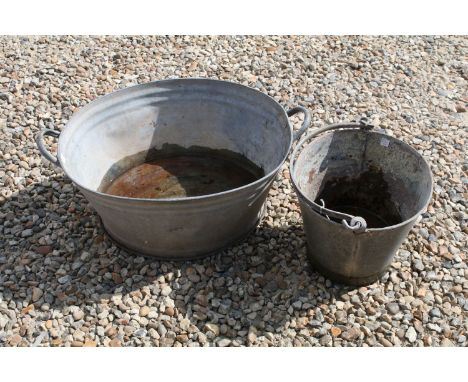 Vintage galvanised small oval bath (approx 58cm long), together with a galvanised bucket 