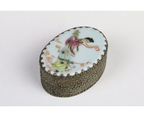 Chinese White Metal Oval Trinket or Snuff Box with Famille Rose Porcelain Panel to lid decorated with a lady carrying a vase,
