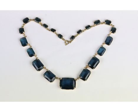 Vintage mid Century riviere necklace set with blue stones. 