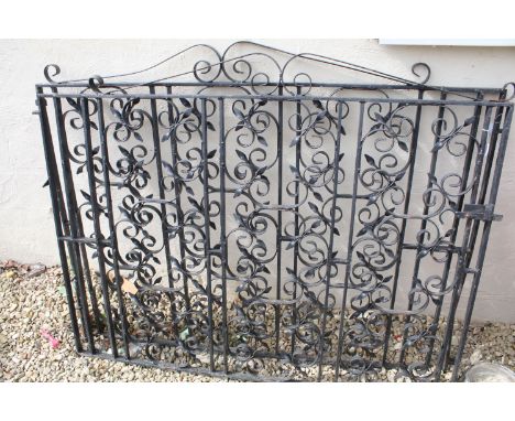 Black painted wrought iron driveway gate of scrolled form, approx 285cm W x 113cm H 