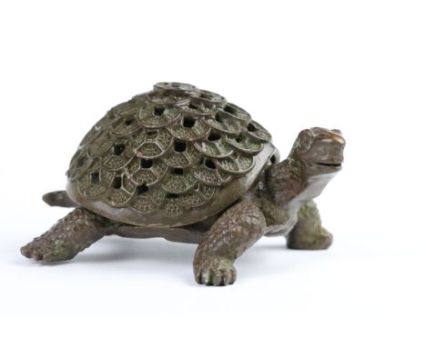 Bronze cast metal figurine in the form of a tortoise with medallion shell. Measures 9cm wide. 