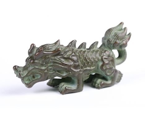 Cast bronze figurine in the form of a Chinese dragon. Measures 8cm wide. 