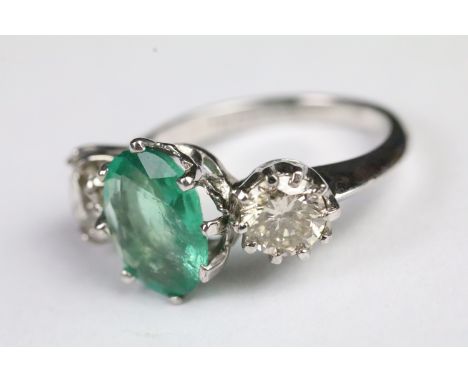 Emerald and diamond three stone ring set in 18ct white gold 