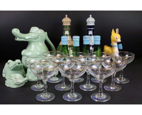 Collection of vintage Babycham glasses with logo emblems (11 total) and promotional advertising Babycham deer accompanying a 
