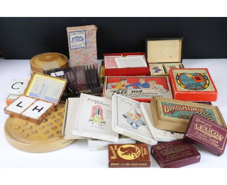 A collection of vintage games to include chess and solitaire together with a selection of card games and playing cards. 