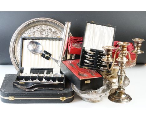 Collection of assorted silver plate to include candlestick, cutlery canteen, dishes, lidded dish, commemorative spoons etc. 