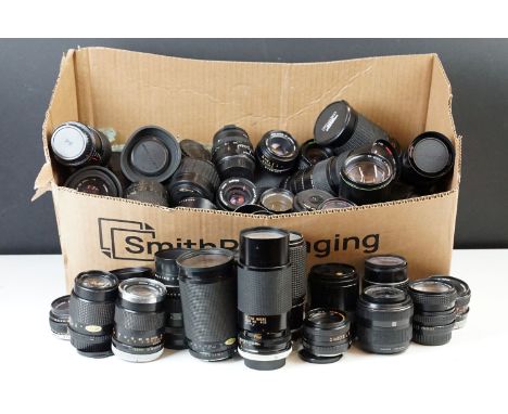 Very large quantity of lenses of prime and zoom lenses featuring brands Canon, Olympus, Minolta and  Pentax. 