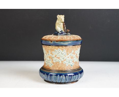 Late Victorian Doulton Lambeth George Tinworth lidded tobacco jar with textured background and applied foliate design, Finial