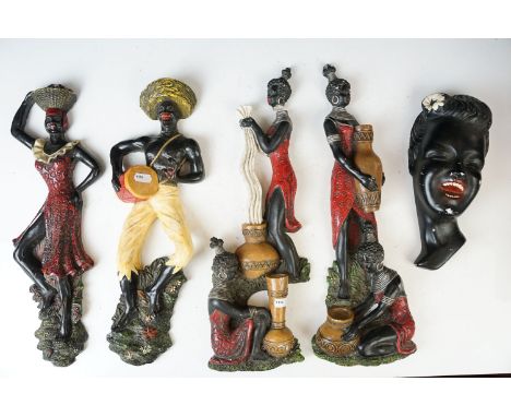 Collection of vintage brightly coloured African flat back, hand painted ceramic wall hanging figures in varying scenes of dan