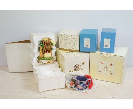 Royal Doulton Winnie the Pooh 'Push Pull!! Come on Pooh' collector figurine along with Disney 'Tied up' winter scene figures,