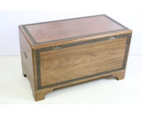 Mid Century Chinese wooden chest raised on bracket feet with carved floral borders. Measures 52 x 91 x 46cm. 