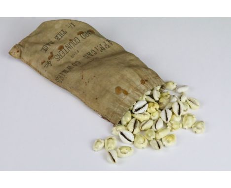Vintage sack of African cowrie shells for card counters and games, with original price of one shilling 
