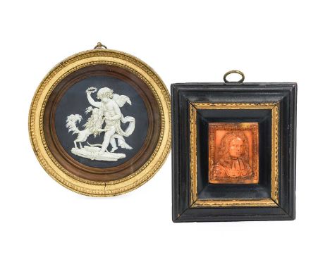 A Carved Amber Panel, probably 17th century, worked in relief with a bust portrait of a gentleman with flowing hair within an