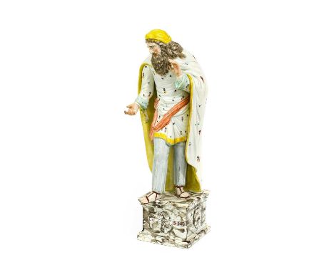 A Staffordshire Pearlware Figure of St Philip, circa 1810, the bearded figure stood wearing a long cloak, coloured in enamels