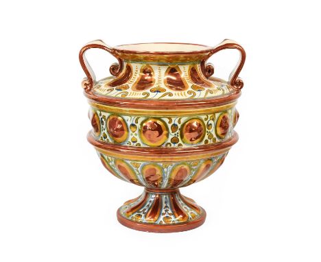 A Cantgalli Faience Vase, late 19th / early 20th century, of twin-handled pedestal form, painted with stylized foliage and ed