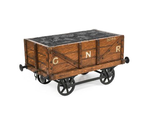 A Novelty Cigar Box, early 20th century, in the form of a railway coal trunk with GNR livery, on four wheels, the hinged coal