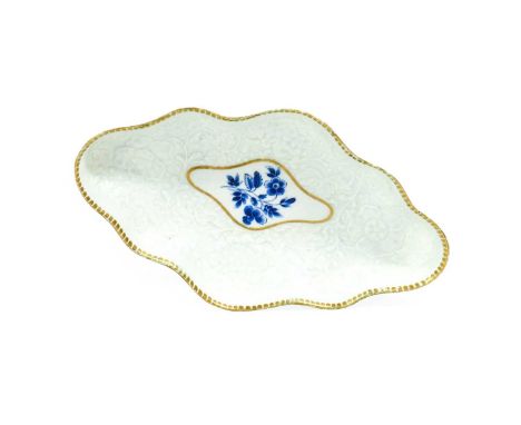 A Worcester Spoon Tray, circa 1770, of lobed lozenge form and crisply moulded with a wide border of chrysanthemums, with a gi
