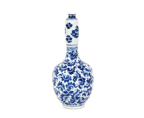 A Chinese Porcelain Bottle Vase, Chenghua reign mark but probably Kangxi, of ovoid form with baluster neck, painted in underg