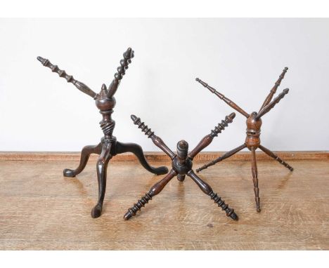 A George III Mahogany Cat, with three revolving bobbin turned spokes over a writhen knop and on tripod base38cm highTwo Simil
