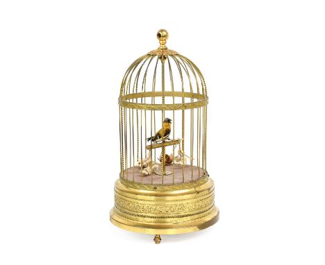 A Singing Bird Automaton, 20th century, the yellow-plumed bird perched within a domed wirework cage over a curcular plinth em