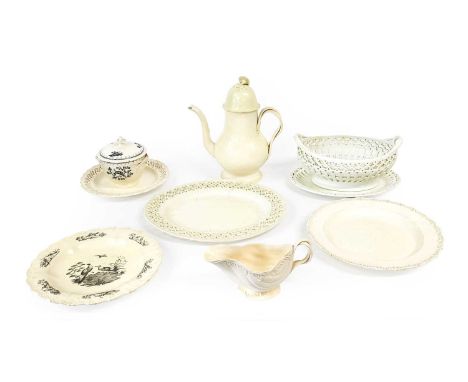 A Creamware Sauceboat, circa 1780, of moulded shell form, with entwined strap handle and feather moulded rim 17cm long A Matc