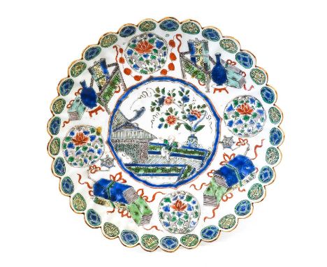 A Chinese Porcelain "Chrysanthemum" Saucer Dish, Kangxi, painted in famille verte enamels with a jumping boy in a garden on a