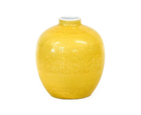 A Chinese Yellow-Ground Porcelain Vase, bears Kangxi reign mark but not of the period, of ovoid form carved with bands of tao