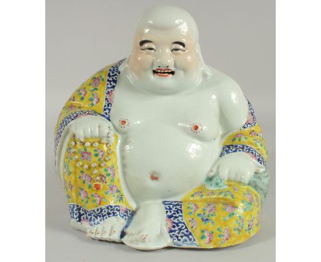 A LARGE CHINESE FAMILLE JAUNE PORCELAIN LAUGHING BUDDHA, the deity modelled in the seated position holding rosary beads, wear