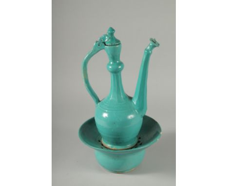 A RARE 17TH-18TH CENTURY PERSAIN SAFAVID MONOCHROME TURQUOISE GLAZED POTTERY LIDDED EWER AND BASIN, ewer 35cm high, basin 24c