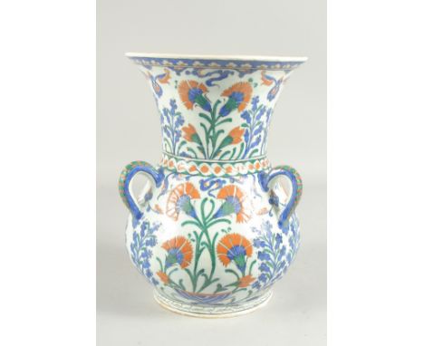 AN OTTOMAN TURKISH IZNIK GLAZED POTTERY MOSQUE LAMP, 31cm high.
