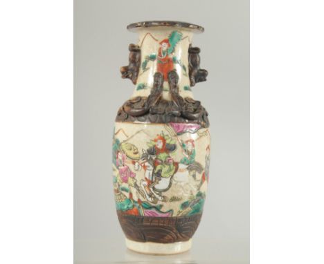 A SMALL CHINESE FAMILLE ROSE GLAZED POTTERY VASE, beautifully painted with figures on horseback, the neck with moulded foo do