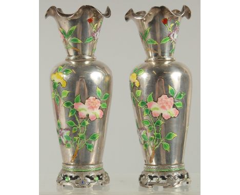 A FINE PAIR OF CHINESE ENAMELLED SILVER VASES, each decorated with enamelled floral sprays, the necks with wavey rims, vases 